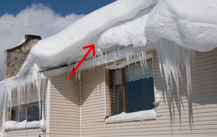 Ice Dam Prevention & Removal by JB Roofing & Gutters in Ankeny, IA – Ice buildup on a home's roof and gutters during winter