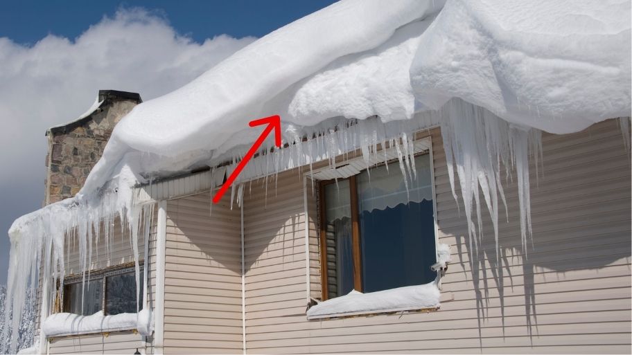 Ice Dam Prevention & Removal by JB Roofing & Gutters in Ankeny, IA – Ice buildup on a home's roof and gutters during winter